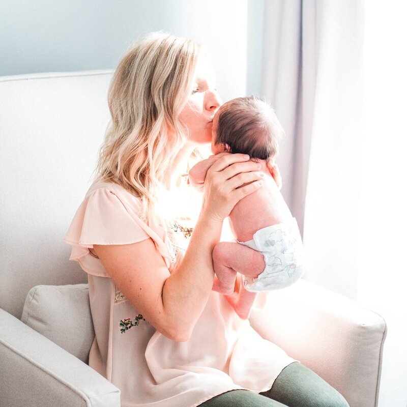 Postpartum Doula, Brooke Leigh Postpartum holds baby in nursery