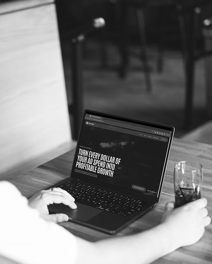 stephen viewing his website on a laptop