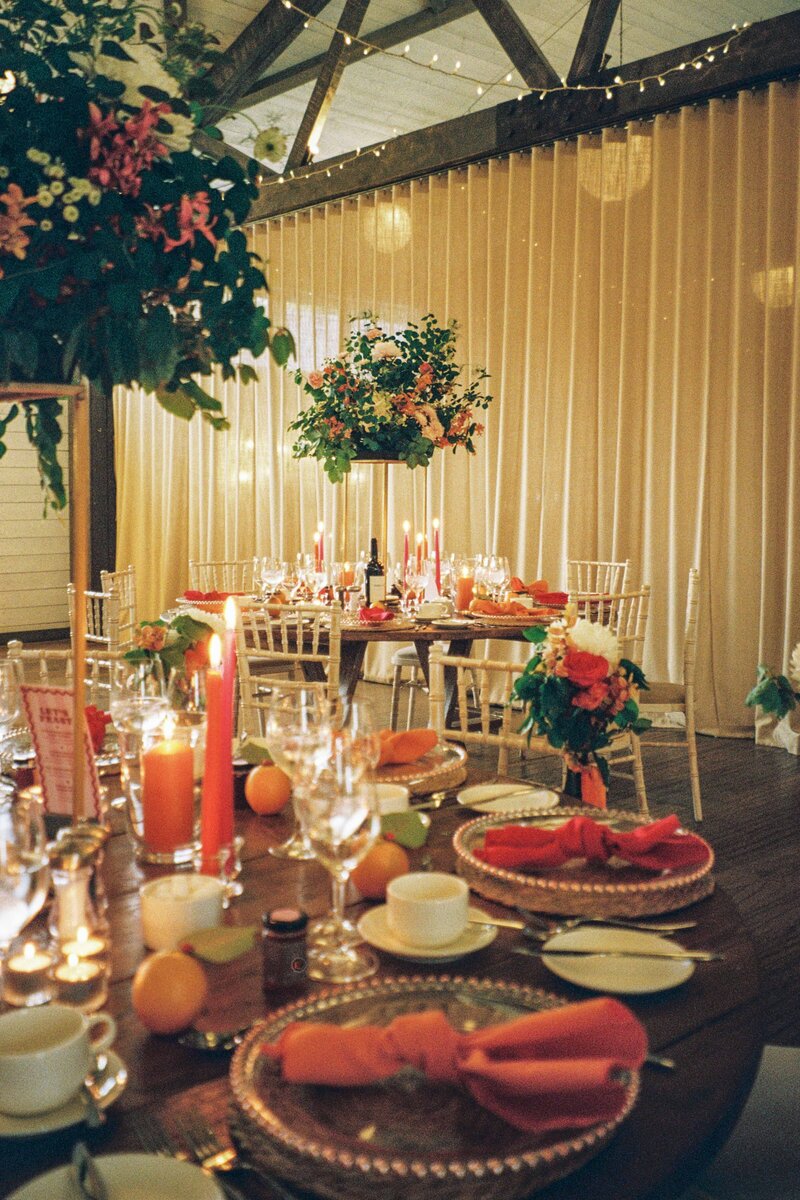 A mid depth photograph of a wedding table set up at Barra Barn in Aberdeenshire.  It is a 35mm film photograph.