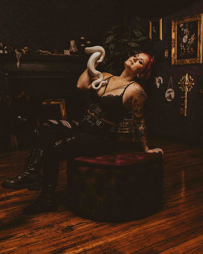 woman holding her snake pet
