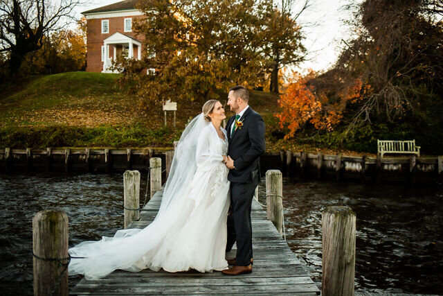 Couple posing on the pier at Historic London town gardens, annapolis wedding photography