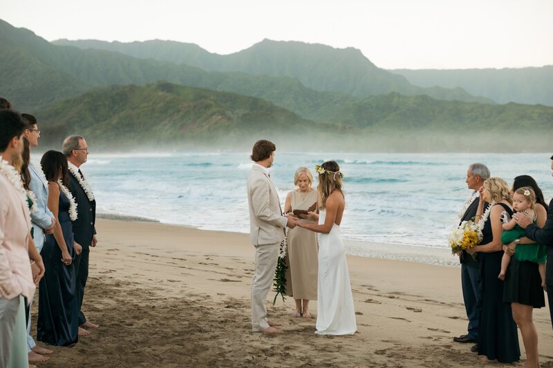 bride and groom eloping on beach in Kauai at Hanalei Bay