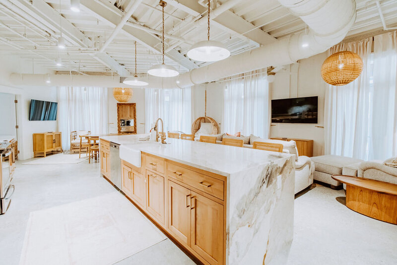 white marbled waterfall kitchen island