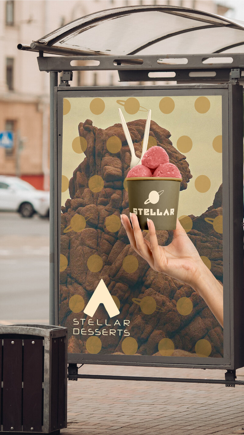 Bus Station ad mockup for stellar desserts a hand holding an ice cream cup in front of a rocky desolate terrain