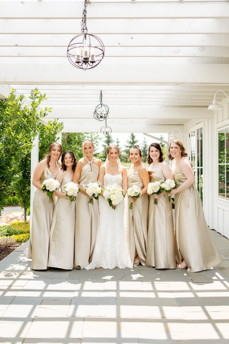 Bridesmaids holding bouquets, taken by st paul wedding photographers Kacey Wyrick