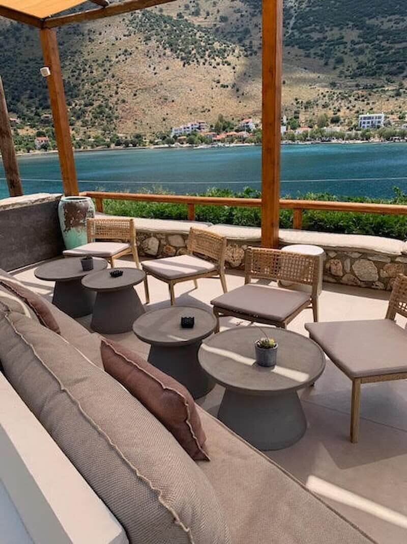 Serene balcony space with ocean panorama.