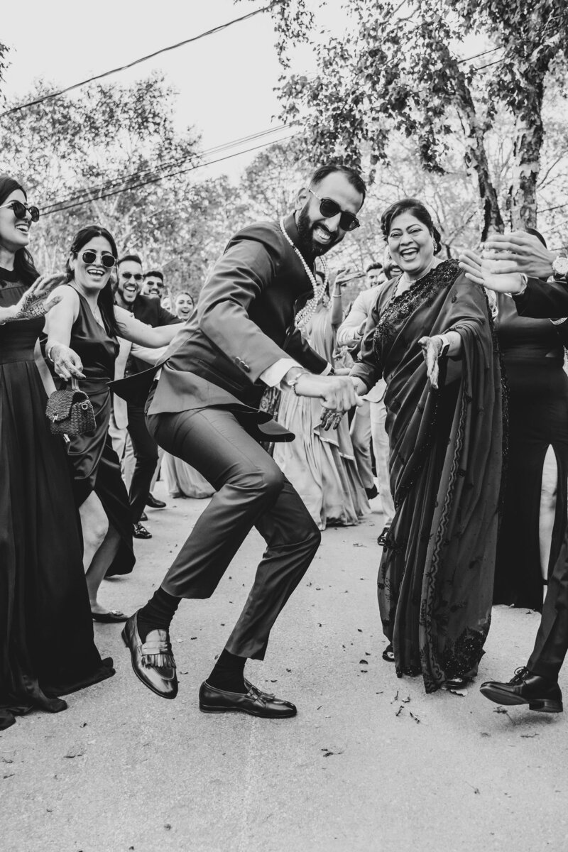 People dancing at Indian wedding.