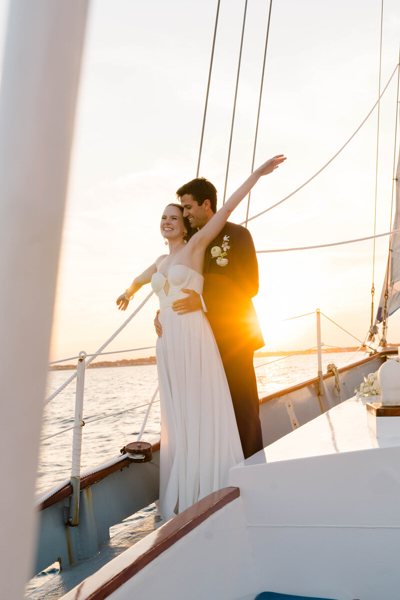 Wedding Photographer Newport RI | Rhode Island Caprio Captured Photography | Couple Embracing At A Sailboat