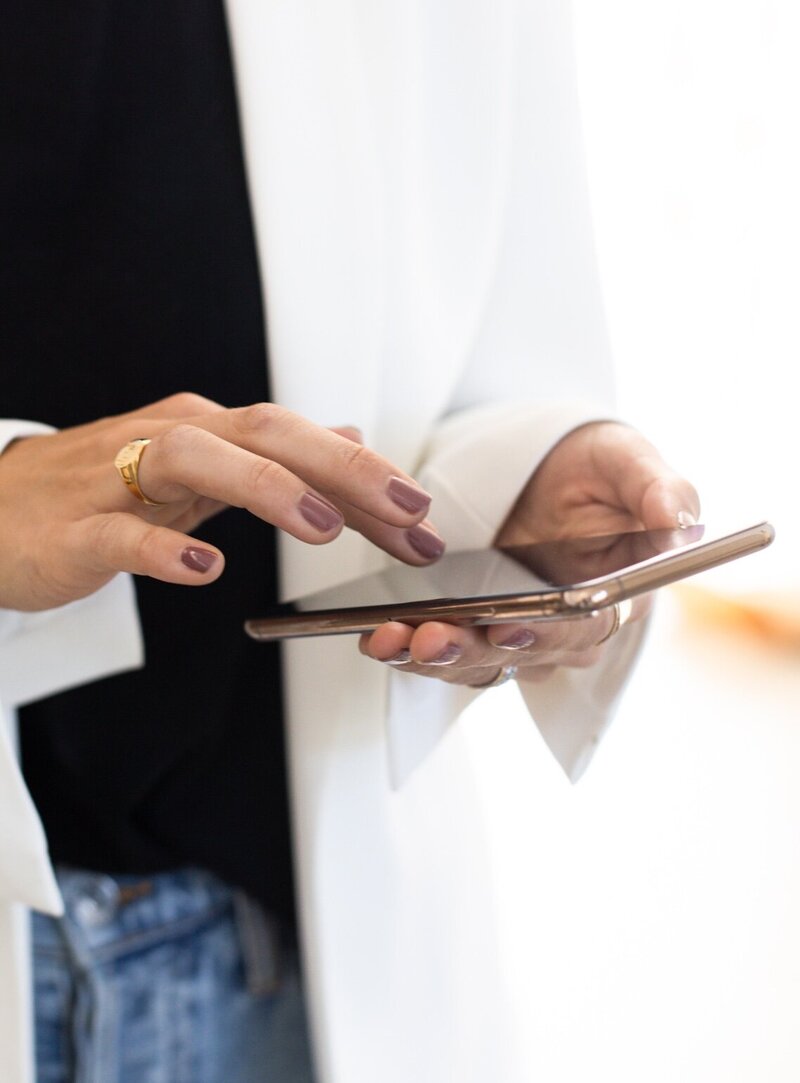 woman typing on new iphone