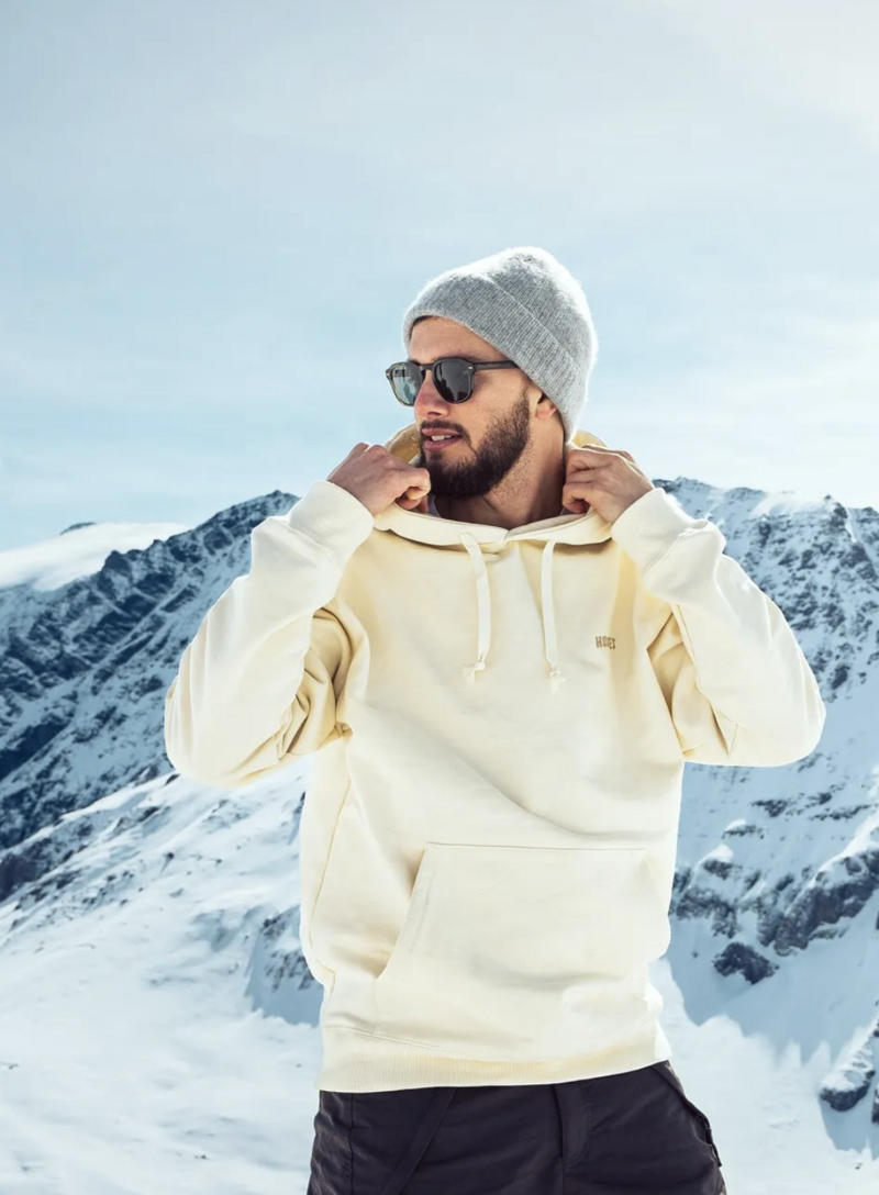 rich turquoise accent wall and mustard gold couch styled