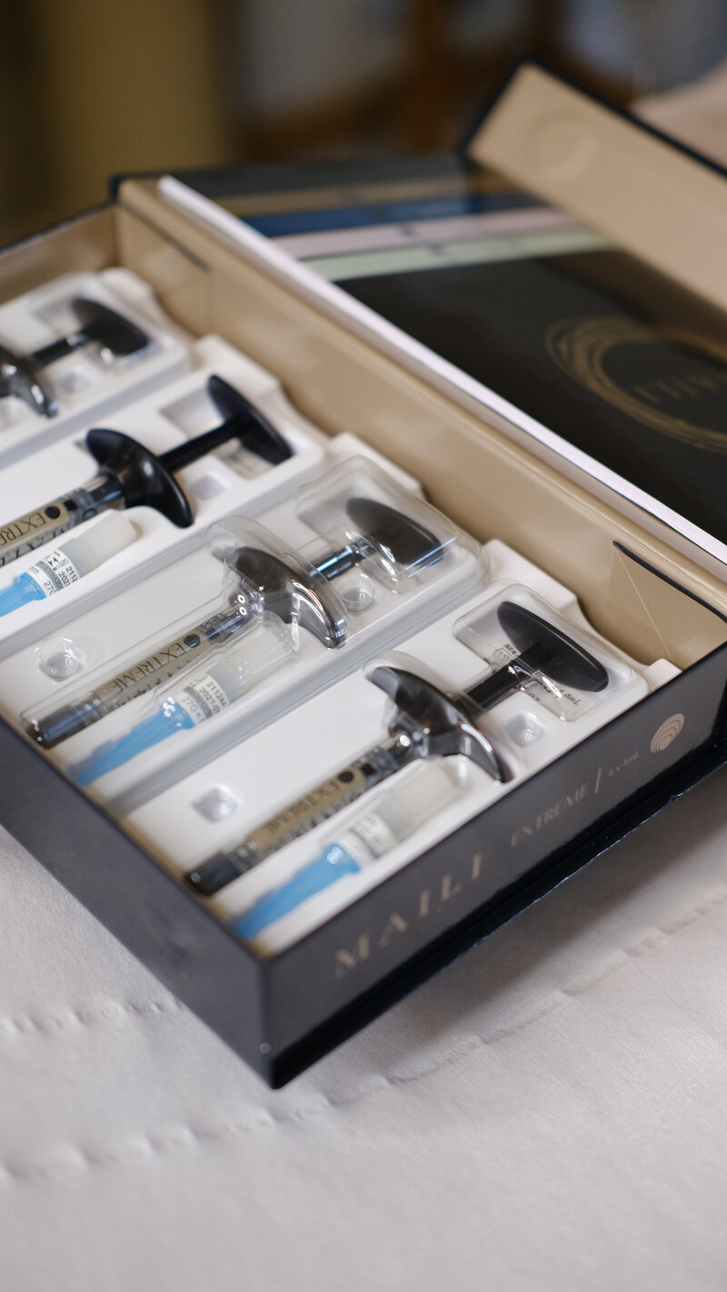 Dermal filler syringes in packaging.