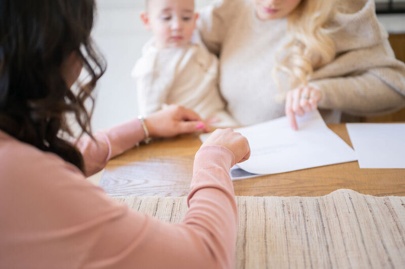 Mom reviewing sleep plan for her baby