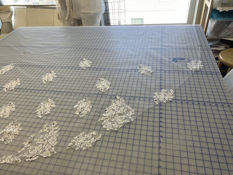 Trisha's heirloom restyled veil in process of designing the placement of lace.
