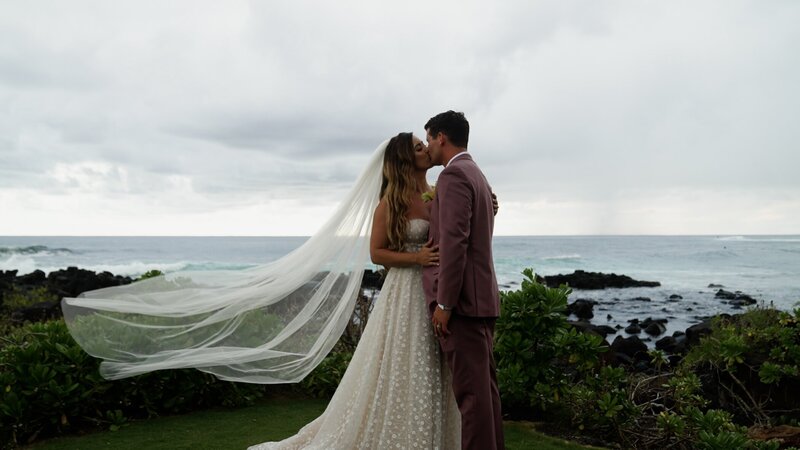 san diego wedding video still bride and groom kissing on beach