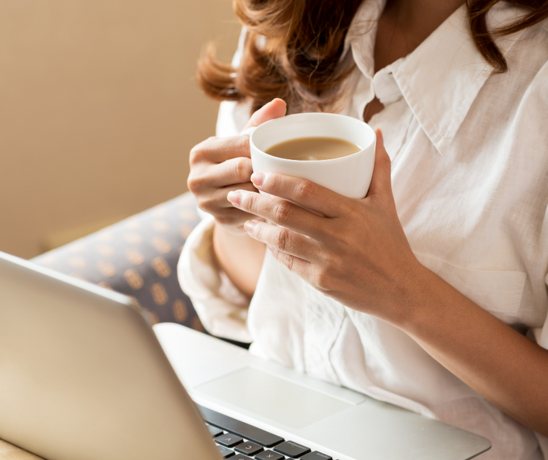 Modern kitchen with a clean countertop, stainless steel faucet, and a vase of fresh flowers, symbolizing a calm, nourishing home environment.