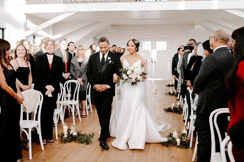 Swank Soiree Dallas Wedding Planner Haile and Christian - walking down the aisle