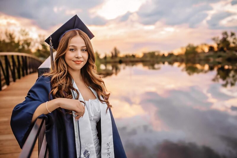 Awesome senior session at Veale Lake  wearing her school cap and gown.