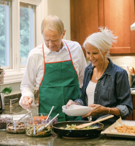 Dr. Smith and Sonja cooking