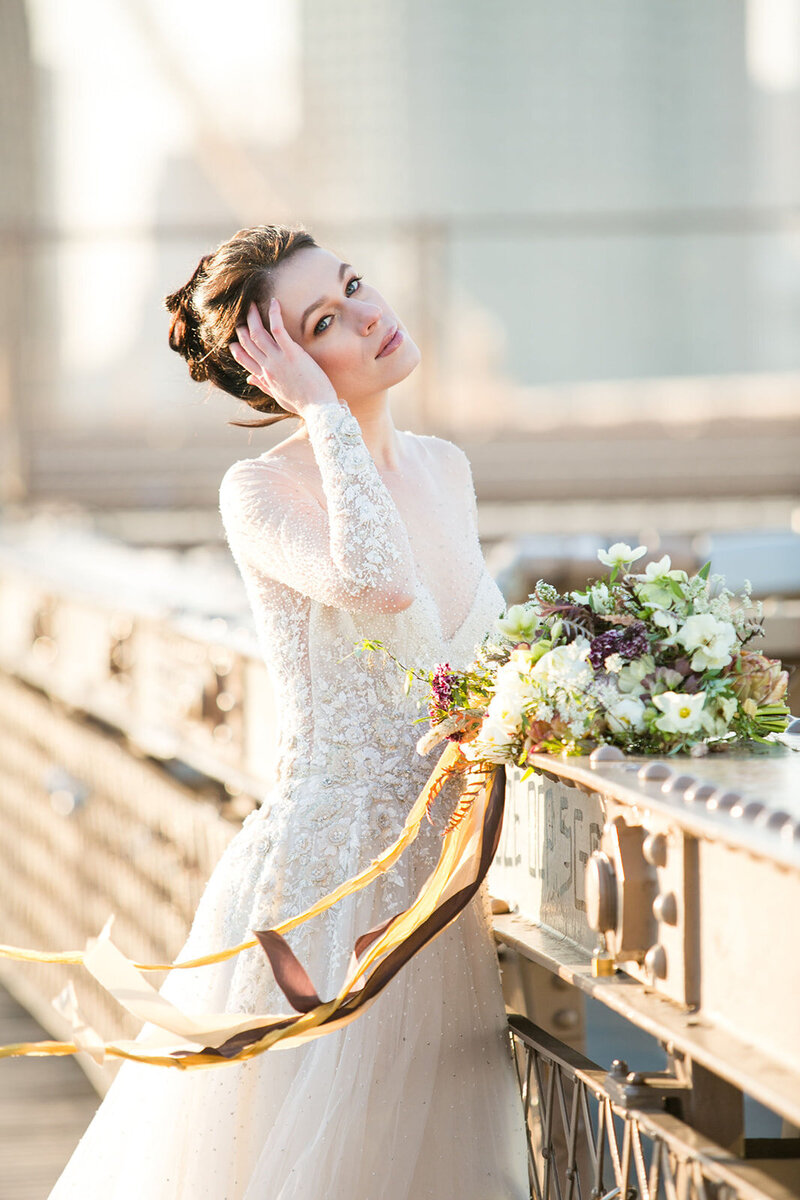 Bride on the Brooklyn Bridge with a bouquet