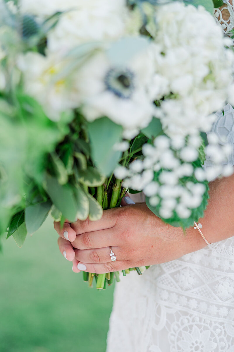 close up of bride holding the flower bouquet