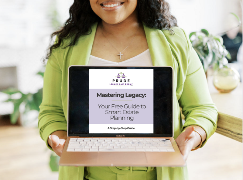 Woman in a green blazer holding a laptop with the cover of 'Mastering Legacy: Your Free Guide to Smart Estate Planning' on the screen."