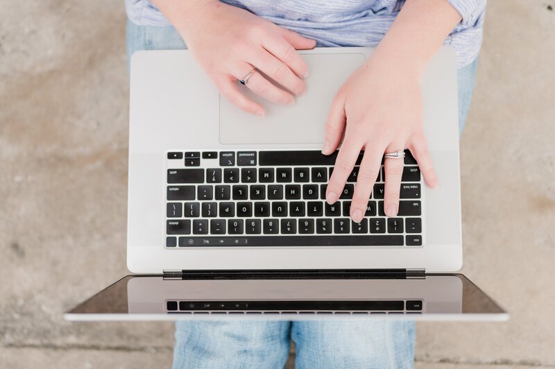 woman typing on a laptop