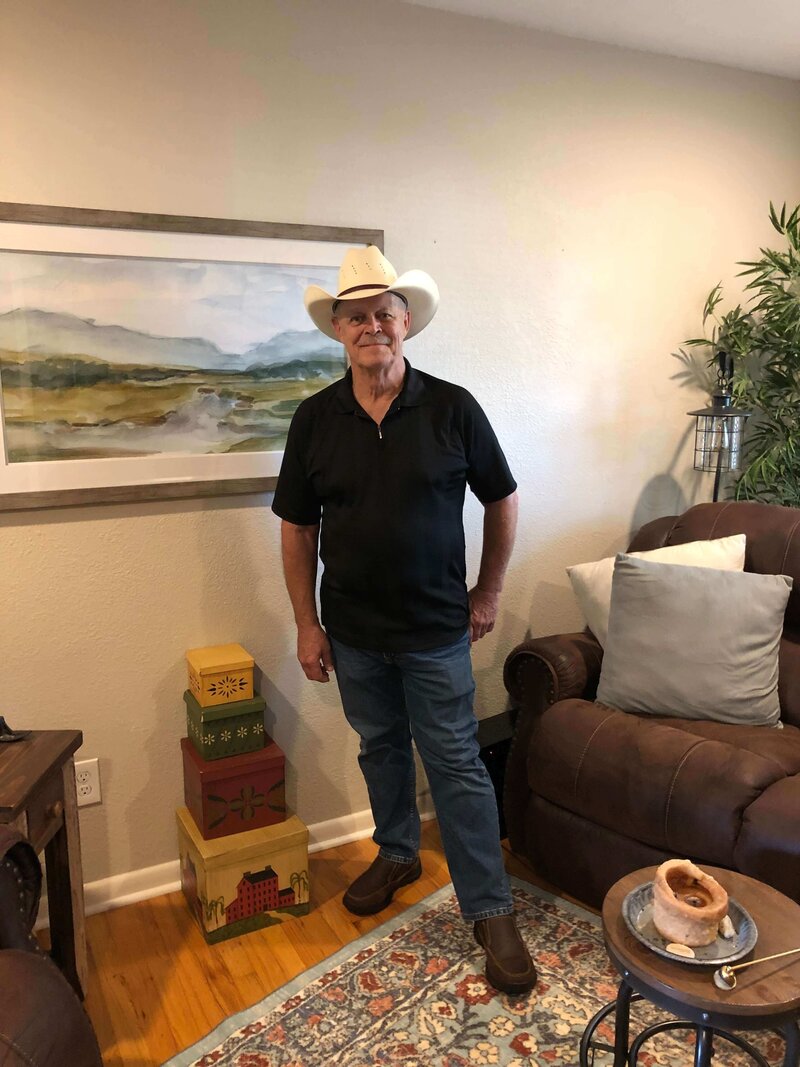 Jim Bartlett posing in a cowboy hat