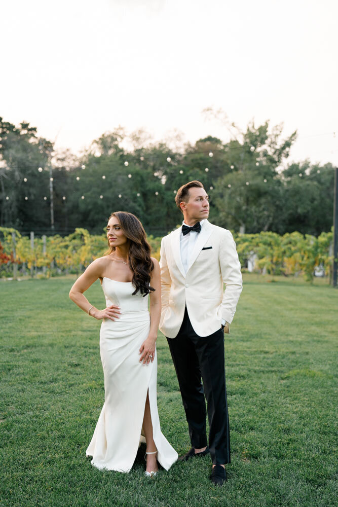 Bride and Groom standing in Vinyard