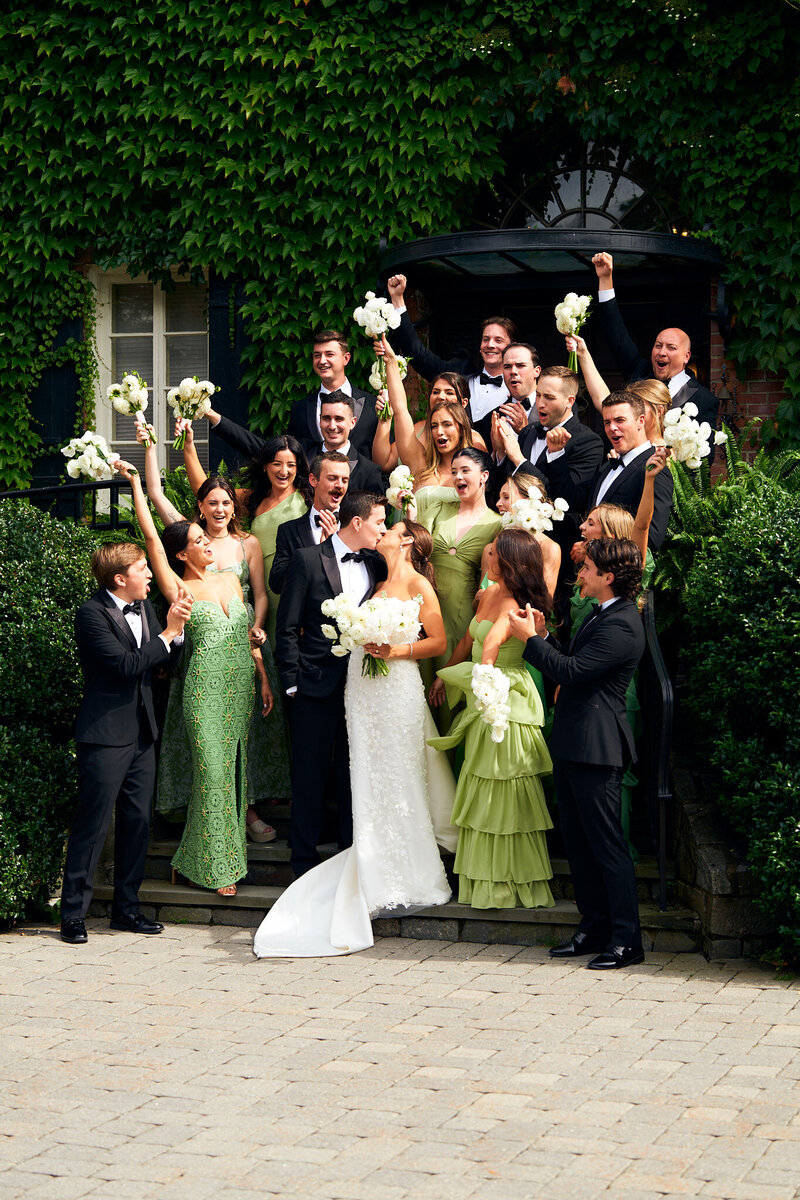 A groom posing in front of Wadsworth mansion in Middletown Connecticut for his wedding day portraits.