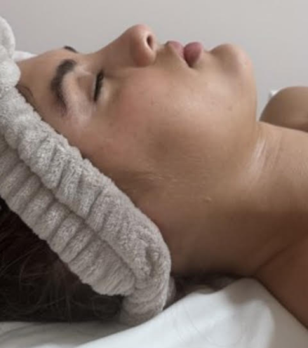 A women after she had a face lymphatic drainage massage