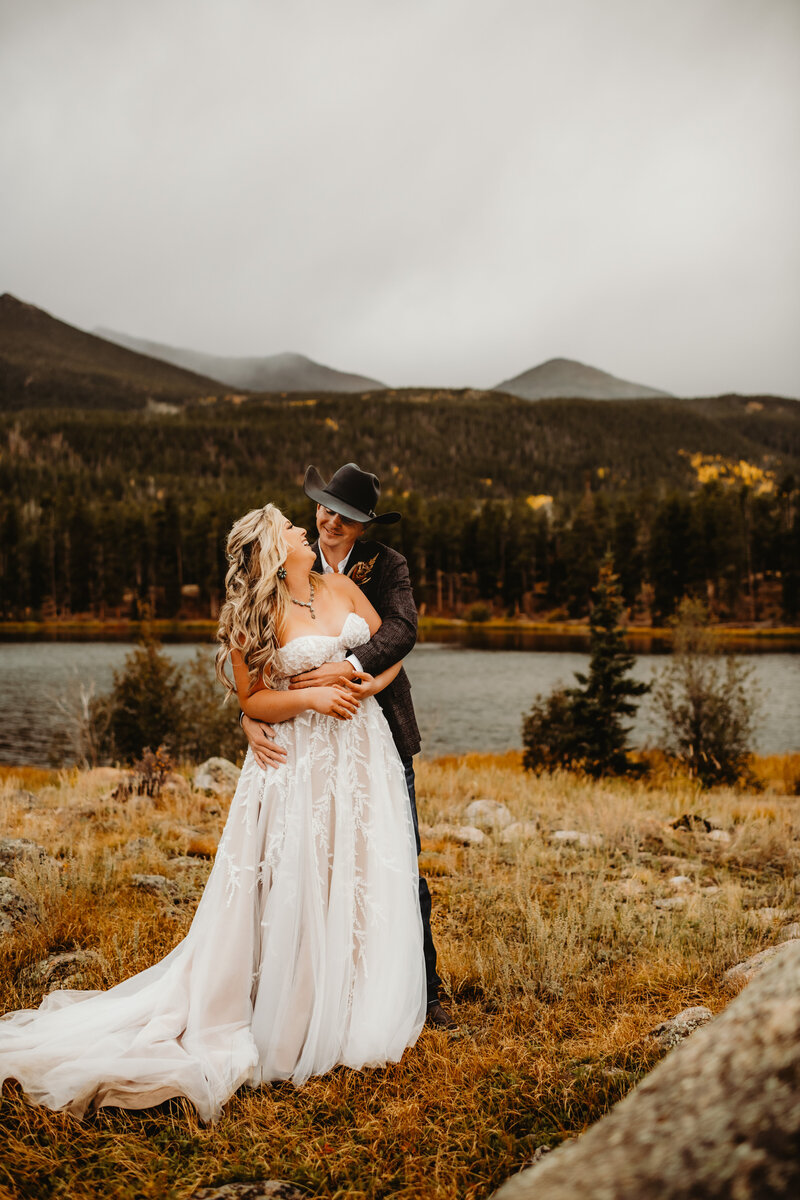 bride and groom hugging and laughing together during rmnp elopement