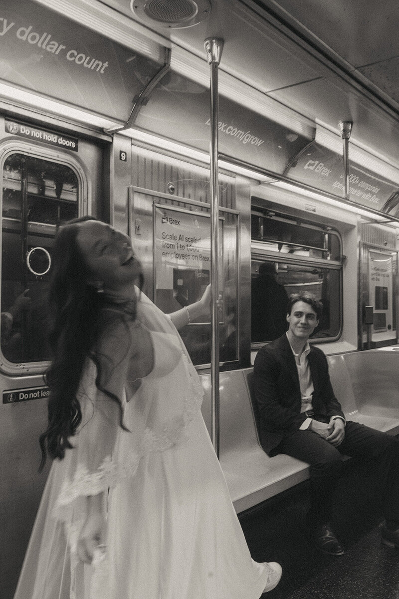 bride and groom riding the subway to city hall to elope shot by Elsie Goodman Photography | NYC Elopement Packages