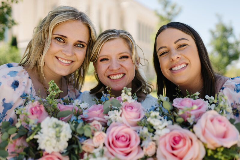 funeral sign in book flower arrangement with peach roses white lilies and green hydrangea 