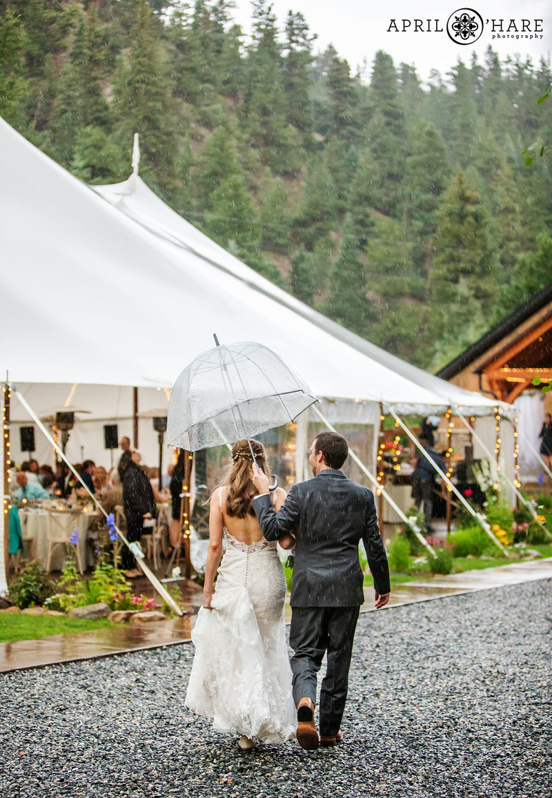 Outdoor wedding under white tent at Blackstone Rivers Ranch in Idaho Springs