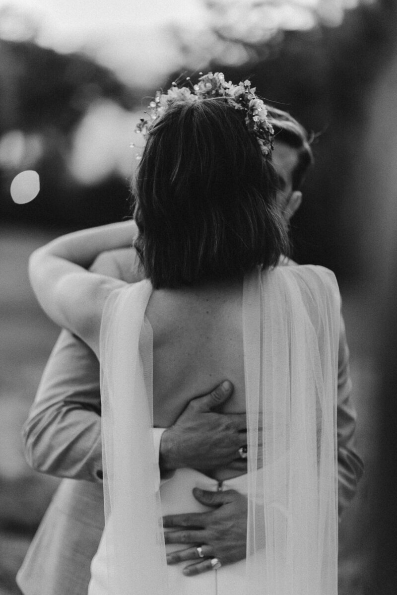 A couple poses in the forest for their Durango wedding portraits