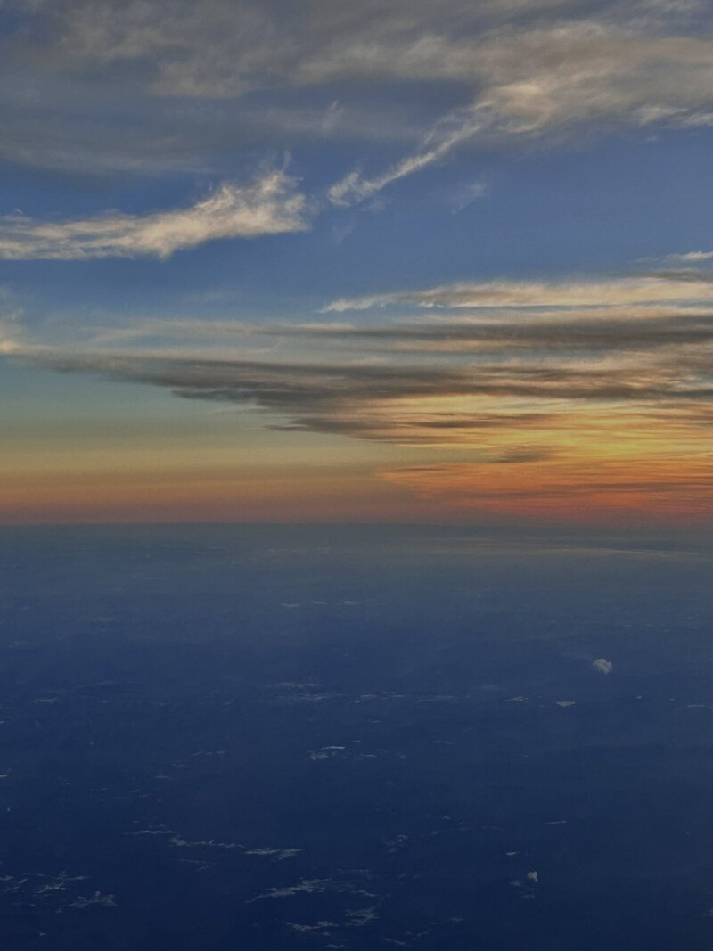 sun set from a plane over Seattle, image take by Caroline Amelie