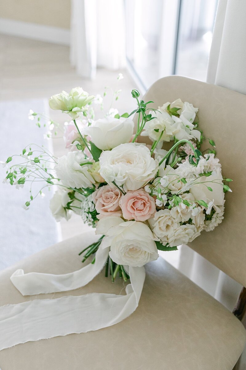 Renee's Bouquet of white roses, a few pink roses and some green unbloomed roses.