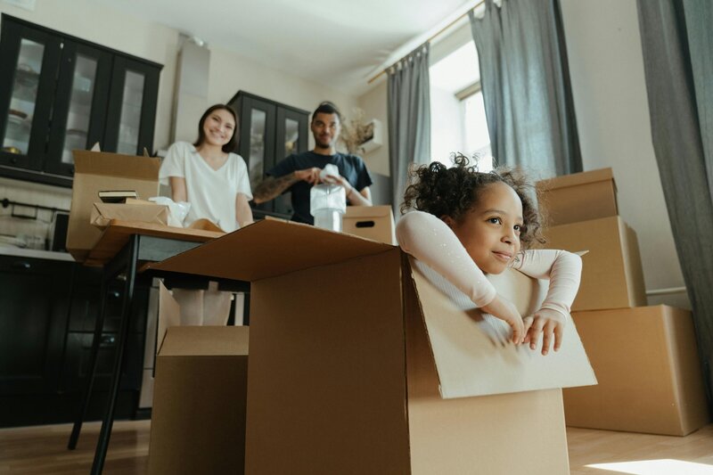 kid playing in box