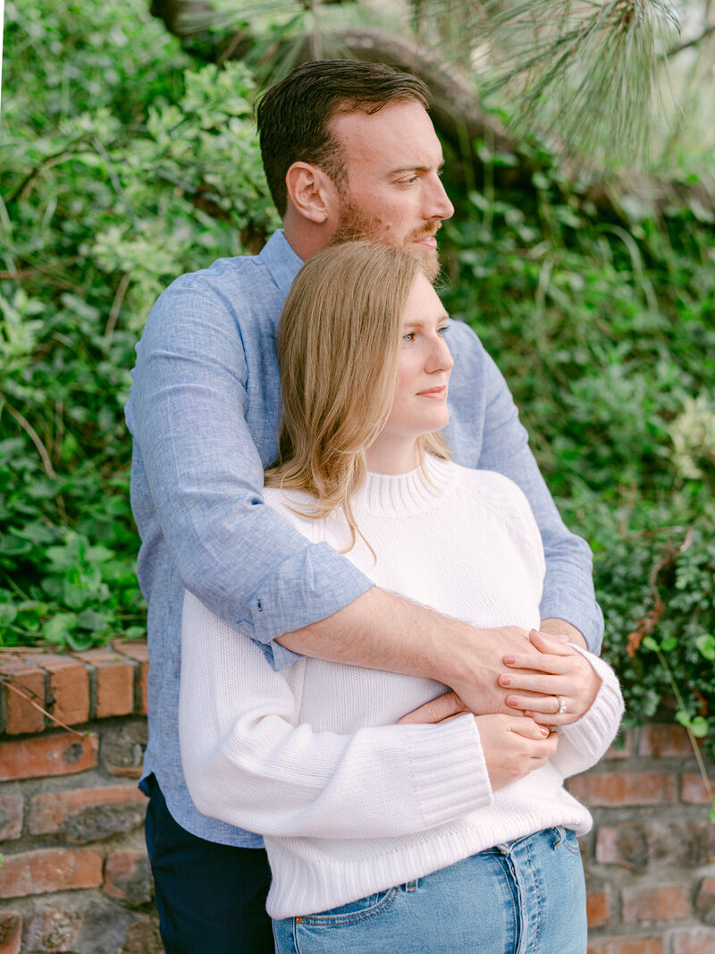 A serene engagement moment at The Lodge at Torrey Pines captured by Michael Asmussen Photography. Amid whispering pines and timeless California architecture, the couple celebrates with rosé and effortless laughter—an image of warmth, elegance, and genuine connection.
