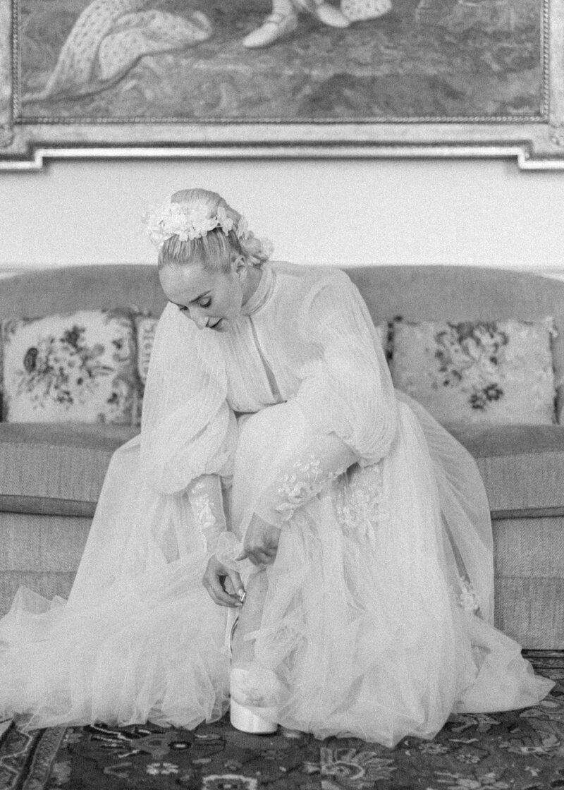 Bride putting on shoes