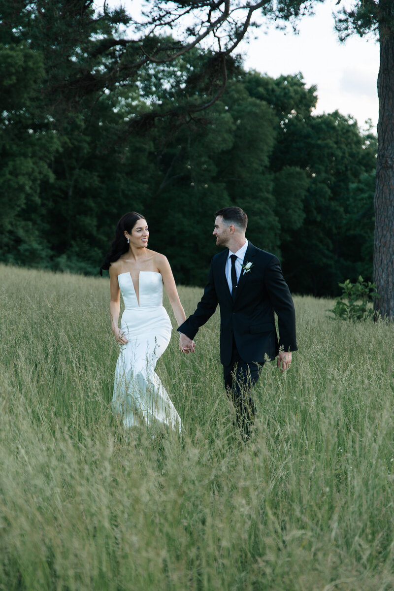 couple standing together in golden hour at the Barn at Edgewood