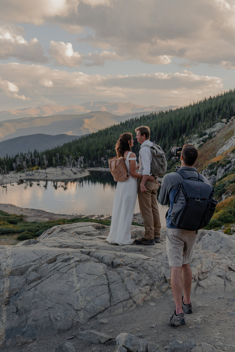 Filming an elopement on the side of a mountain in Colorado at St. Mary's Glacier with a beautiful couple