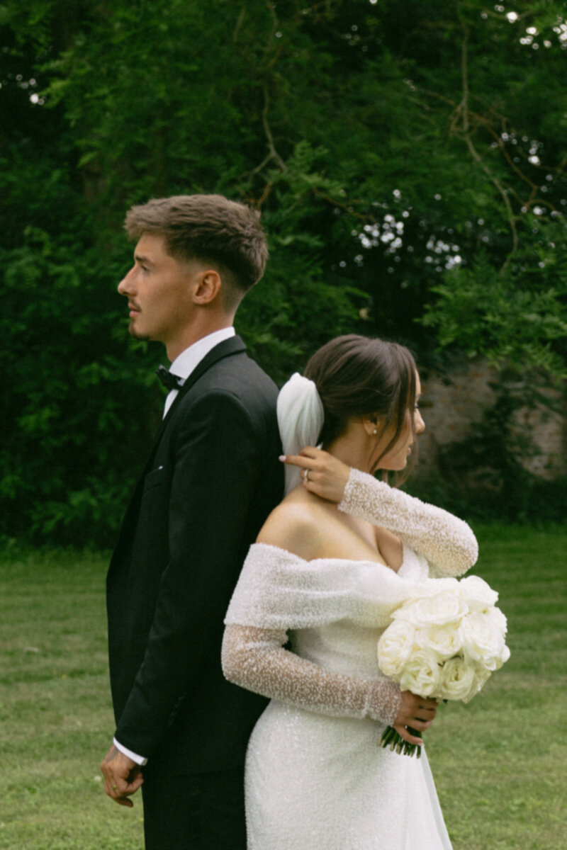 Luxury wedding in Europe – sophisticated bride in a modern wedding gown and groom in a timeless suit.