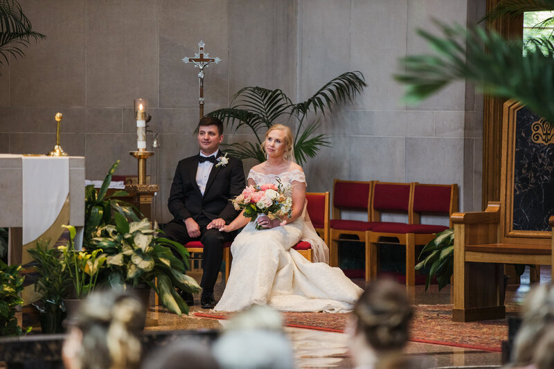 bride and groom during catholic wedding ceremony
