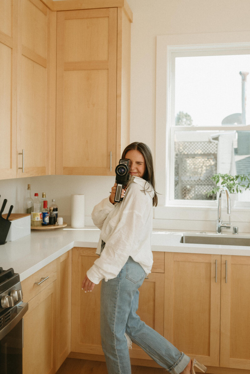 Alexandra Eveland in her kitchen shooting super 8