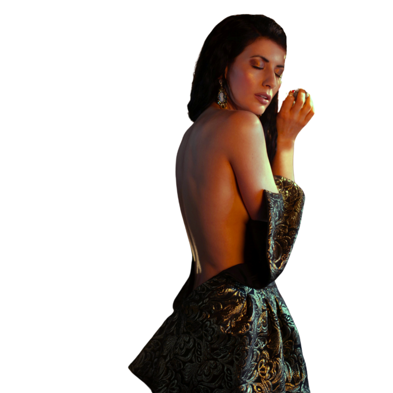 Dark aesthetic model holding a prop for Elyana Studio showit website branding