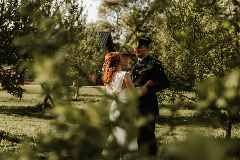 bride and groom in vineyard in cornwall