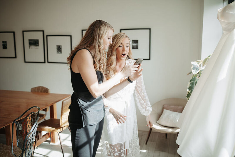 wedding planner reviewing details with bride 