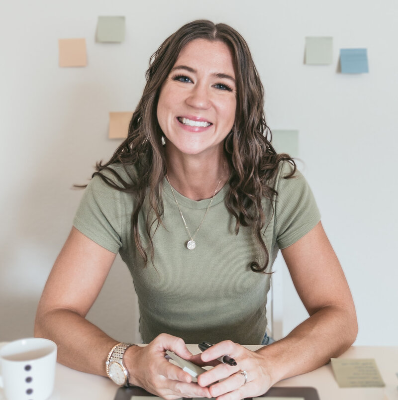 Maria Burke smiles at the camera while working on a design strategy