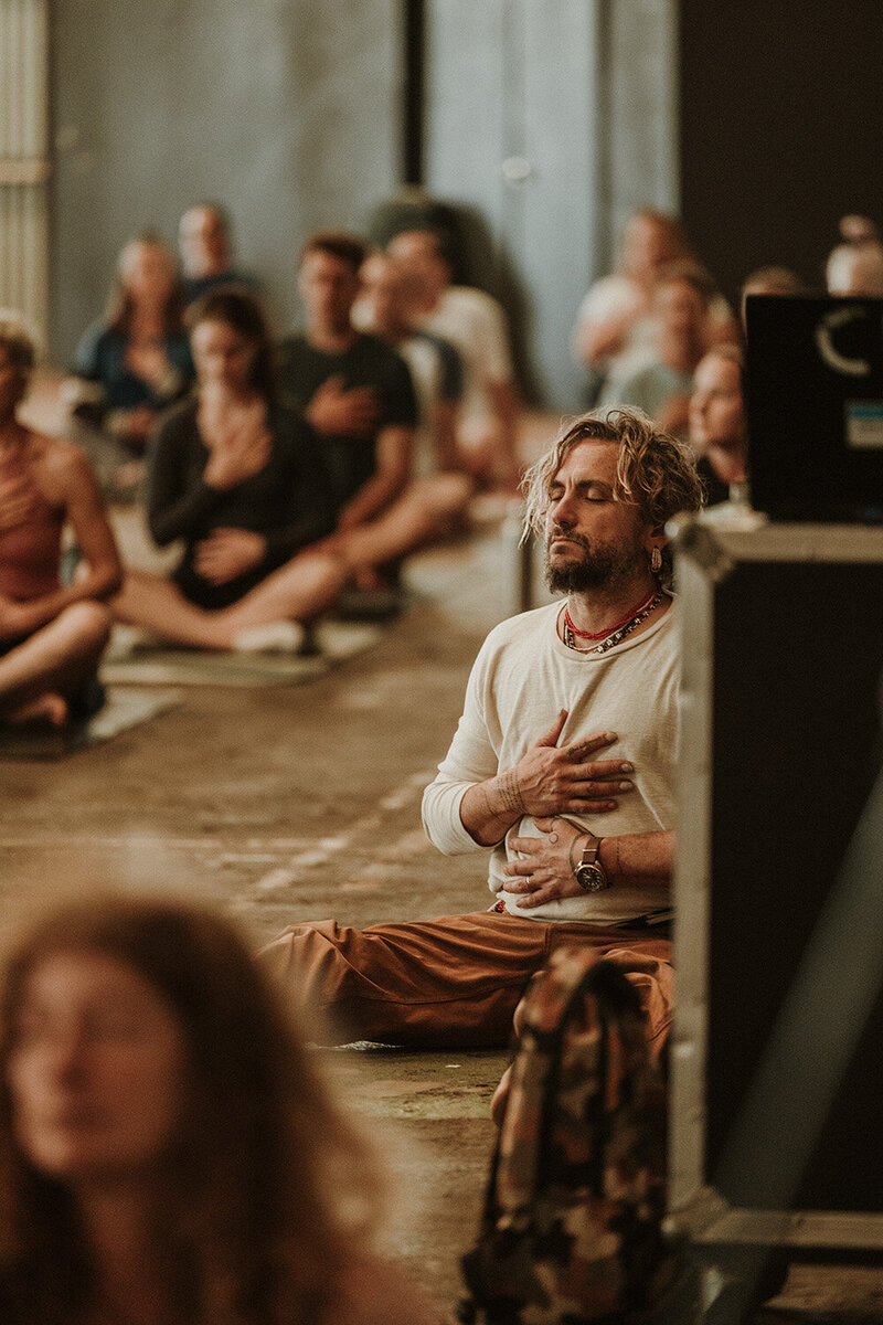 A Sunshine coast wellness retreat with John Butler, meditating in a group by Sunshine coast wedding photographer